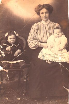 1911 Elizabeth Martha Wiltshire nee West with her two children Bertha Frances and Clive Gordon
Martha Coleman (1858-1924), the second child to Bridget Carrucan and John Coleman, married William West in 1878.
They had 13 children between 1979 and 1896, the first 8 born in Eltham and the remaining 5 born in Research where they moved in 1890. They lived the remainder of their lives in the Research Hotel where William was the proprietor.
This photo shows the seventh child, Elizabeth Martha Wiltshire nee West, with her two children Bertha Frances Wiltshire and Clive Gordon Wiltshire. Bertha was born in 1909 and Clive in 1910. Clive died in QLD in 1998. Bertha died in Sandringham in 2001.
This photo was passed onto us by Clive's grand daughter Karen Hough.
