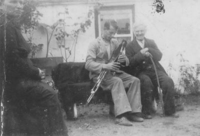 1930s early - We originally thought this was a photo of travelling piper Johnny Doran with Jimmy Carrucan's father in law, Jack Clair, at St Bridget's Well, Liscannor. Further discussion indicates that it might in fact be a photo of piper Tim Wr
