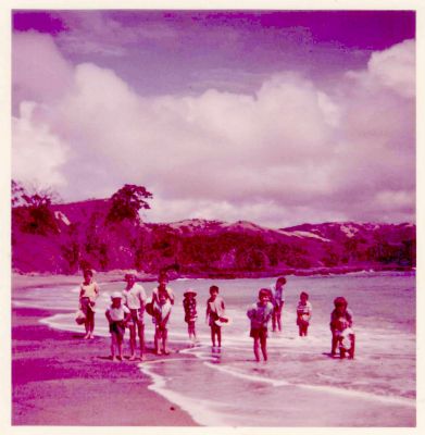 1970s - typical NZ beach family gathering at the beach
Typical NZ beach family gathering, possibly some time in the late 1960s.

Matthew Carrucan comments :Location unconfirmed - I think it is with the Baileys in Whangarei.
