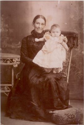 1870s late - Bridget Lane (nee Carrucan) with one of her children
Bridget Lane (nee Carrucan) 1858-1949 with one of her children. We think it is either her first child Michael (Mick), born 1876, but maybe her third child and first daughter, Mary Anastasia (1879 - 1900). Thus the photo must date from the late 1870s.
