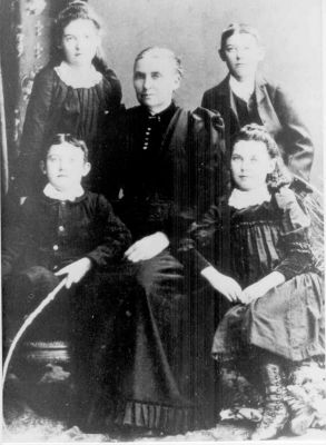 1890 approx - Margaret Doherty (right) as a child - later married John Francis Carruca
This photo, taken around 1890, shows Margaret Ellen Doherty (right front) as a child. She later married John Francis Carrucan and a stong Carrucan line has ensued. The photo also shows her mother Honora Doherty (nee Hurley), born in Co. Clare in Ireland in 1845, and her other 3 siblings Mary (Cissy) - b 1880, Patrick - b 1878, and Cornelius - b 1884. Honora and her husband Cornelius were both born in Co. Clare but migrated to Australia and all the children were born in Creswick near Ballarat (Victoria).
