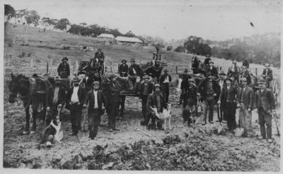 1880s - Depression Work in Research - the creation of the aquaduct
Local farmers had to supplement incomes where possible, especially during the Great Depression of the late 1880's. At that time, able men travelled far and wide in an effort to bring in extra money. One of the Depression initiatives was the building of the aquaduct that carried water from the Maroondah reservoir though the Eltham and Research areas and ended at Reservoir.. This photo shows a gang of men, including my grandfather Michael Carrucan (so I was told by older family members) working at Research.
