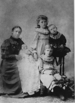1896 - Bridget Lane (nee Carrucan) with children Syl, Tom, Ellen and Bridget (Dolly)
Bridget CARRUCAN (1858-1949) married Patrick Richard LANE (1851-1896) in 1875. The photo shows Bridget with 4 of her children. We are working on birth dates but we believe they are

Baby - Syl, Feb 1896
Boy in black - Tom, Aug 1893 would be 2 years 6 months
Ellen - Oct 1887, sitting, would be 8 years 4 months
Bridget (Dolly), Jan 1884, standing, 12 years 1 month
