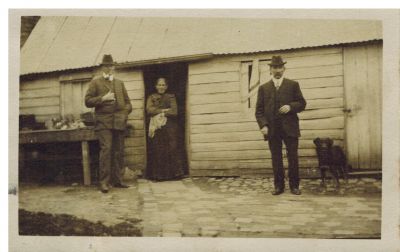1910 approx Dalton St Farm Michael O'Heare Michael Carrucan Mary Carrucan
This shows the back of the old Dalton St farm circa 1910. On the left is Michael O'Heare, a well known local solicitor who was one of the groomsmen at Michael Carrucan's wedding (1910). Michael Carrucan is shown on the right and Michael Carrucan's mother Mary (nee O'Brien) who was born in 1838 in Ireland is in the middle. She would have been around 72 at this time. She eventually died in 1927 aged 89.
This photo was no doubt taken by Joseph Rance Douie, a friend of Michael O'Heare. Joseph says on the back of the photo 'It is many years since I took this photo ...'
