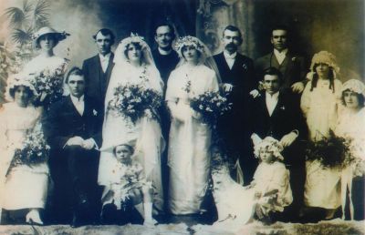 1914 - double wedding of Cornelius Lane and Patrick Lane
This photo shows a double wedding - Cornelius Joseph Lane marring Lucy Woodward and Patrick Lane marrying Eva Jones in 1914. Cornelius and Patrick were two of the 13 children born to Bridget Carrucan (1858-1949) and Patrick Richard Lane (1851-1926) and were grand children of Patrick Carrucan and Mary O'Brien. Photo from Cherie Honey.
Back Row: Eileen Outridge, Percy Woodward, Father Donohoe, Mick Lane, Tom Lane, Eileen Lane
Brides: Lucy Woodward, Eva Jones
Seated: Jessie Woodward, Cornelius Lane, Patrick Lane, Tot Jones
Flower Girl: Mary Honoria (Bonny) McMahon
Page Boy: Jack Woodward
