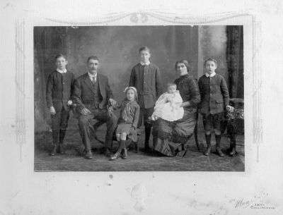 1915 - Edward Bourke and Margaret Theresa Bourke (nee Carrucan) with their family
1915 - Edward Bourke and Margaret Theresa Bourke (nee Carrucan) with their children from L to R
Phillip (Mick), Mary, Patrick, baby Kathleen (Kitty) and Francis (Frank).

Family Details:
- Margaret Theresa CARRUCAN (1871-1920) & Edward BOURKE m. St John's, Heidelberg, Vic., Ausralia\r\n- Patrick Leo BOURKE (1902-1961)
- Philip Edward Michael (Mick) BOURKE (1904-1971)
- Francis James (Frank) BOURKE (1906-1987)\r\n- Mary BOURKE (1908-?)
- Kathleen (Kitty) BOURKE (1914-1995)
