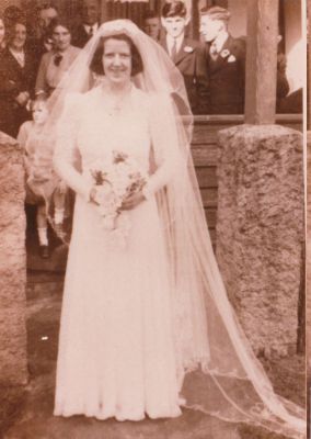 1941 Mary Frances (Molly) Kelly nee Ganly with her brother Malachi
Mary Jane (Girlie) Carrucan (1889-1961), a grand daughter of Patrick Carrucan, married Michael Joseph (Mick) Ganly (1881-1955) in 1911 and they had eight children: John (Jack), Ellen (Toppy), Mary Frances (Molly), Kathleen, Margaret (Peg), Michael (Mick), Malachi and Alicia.
This photo is taken at the wedding of Molly in 1941. Her brother Malachi is behind her on the right.
