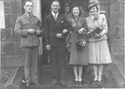 1946 wedding Betty Carrucan - with new husband Eric Erickson-2
In 1946, Elizabeth Agatha (Betty) Carrucan married Gunnar Eric Erickson, a Swedish engineer whom she met in Stawell where she was teaching and he was working on drilling bores. They went to live in Captains Flat in southern NSW where Gunner worked on the Snowy Mountain Schema. Mick and Terry Erickson were born in that harsh and rugged environment and one further son, Tim, was born in Greensborough. Betty was born in Eltham in 1915 and was the granddaughter of Patrick Carrucan who migrated from Co. Clare.
Betty and Eric are shown with Maid of Honour Marie Murphy nee Hickey, one of Betty's girlhood friends from Eltham.
