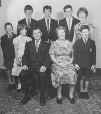 1961 - Peter Tony Bernie Maureen Mick Theresa Bernie Mary Chris Kelly
This photo, taken in 1961, shows Mary Frances (Molly) (1916-1992) and Bernard Thomas Kelly (1916-1980) with their 7 children.
Molly was the great grand daughter of Patrick Carrucan\r\nThe photo shows Peter, Tony, Bernie, Maureen, Mick, Theresa, Bernie, Molly and Chris Kelly.
