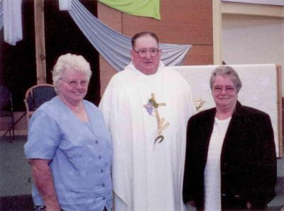 2003 - Fr Pat Smith with sisters Mary Ann and Margaret
Myles Patrick (Pat) Smith (1935 -) entered the Christian Brothers' Juniorate at 15 and subsequently taught in various States in Australia and in New Zealand. Due to his health he eventually moved north and worked as a pastoral associate in Charleville, Queensland and then in Texas where he celebrated his Golden Jubilee in 1999. He was ordained a Catholic priest in 2003, and has now retired to Toowoomba.
This photo shows Fr Pat Smith, newly ordained in 2003, with his sisters Mary Ann and Margaret.
