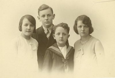 1928 - Enid Donald John and Patricia Carrucan
Kevin James O'Doherty Carrucan (1885 - 1933) was the oldest child of five to Patrick Joseph Carrucan and Agnes Mary Hardbottle and was a grandson of Peter Carrucan and Hannah Woods. He married Rubina Beaton in 1910 and they had four children Patricia (1911), Donald (1914), Enid (1919) and John (1921). This photo, taken around 1928, shows the 4 children. At that time Kevin held the position as the Secretary to the Australian Ambassador at Australia House in London while his wife Rubina and the children lived in Brugge in Belgium.
