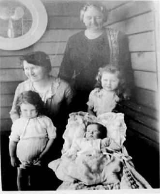 1928 - Ruby Mabel Clare OCarroll nee Carrucan with her mother and her children
Ruby Mabel Clare Carrucan (1891 - 1979), one of the 5 children born to Patrick Joseph Carrucan and Agnes Mary Hardbottle, was a granddaughter of Peter Carrucan and Hannah Woods. She married Joseph Patrick O'Carroll and they had Mary (1923), Patricia (1926), Theresa (1928) and William (1932). This photo shows:
Back - her mother Agnes Mary Carrucan nee Hardbottle\r\nMiddle - Ruby O'Carroll nee Carrucan with daughter Mary
Front - Daughters Patricia and Theresa
