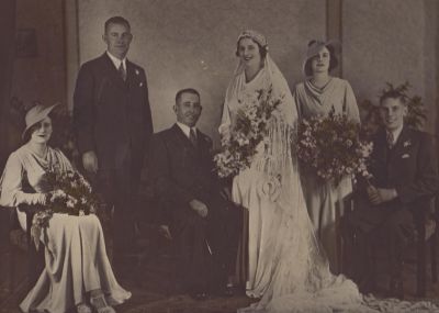 1935 - Leo and Mary Carrucan wedding party
Leo Carrucan, the fourth child of Margaret and Michael Carrucan of Kew, was born on 23rd December 1901. He met Mary Ellen Angus from Hawthorn in 1927 and they married in January 1935 at Immaculate Conception Church, Hawthorn. This photo shows Mary and Leo on their wedding day.
Mary and Leo had one daughter, Mary Therese, in April 1938 but, ten days after giving birth, Mary died of cancer. In 1940, Leo married Dorothy Hopper and Leo and Dorothy brought up his young daughter Mary.
Leo died suddenly on 27th March 1958 from a heart attack while sitting in his truck at the Alphington Quarries. He was only 57 years of age. He was buried in the Kew Cemetery.
His daughter Mary married Thomas Joseph Holden and they in turn have 3 children Andrew (b 1966), Janet (b 1968) and Meaghan (b 1972).

