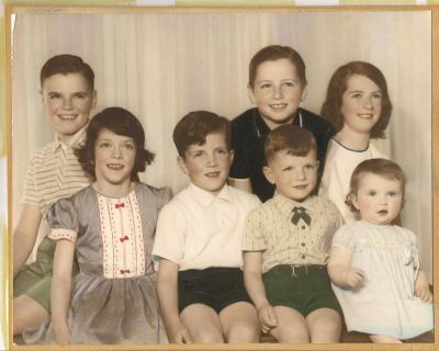 1965 Circa - Family portrait of all the children of Gavin Carrucan and Gwen Lodge
Family portrait of all the children of Gavin Carrucan and Gwen Lodge. The children are Christine (born 1953), David (born 1955), Louise (born 1957), Michael (born 1958), Andrew (born 1959), Anthony (born 1962) and Suzanne (born 1964). Photo sourced from Gavin's and Gwen's son Michael and passed on by his nephew Kieran Magee, who is a great great grandson of Peter and Hannah.
