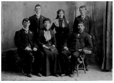 1902 John Francis Ryan and Ellen Elizabeth Sweeney with children Thomas John Margaret and Francis (Frank)
Ellen Elizabeth Sweeney (1845-1932), one of the daughters of Thomas Sweeney, married John Francis Ryan in 1880 in Cormandel, NZ. They are shown here with their 4 children Thomas Joseph "Tom" (born 1882), Margaret Katherine "Tissa" (born 1883), John Desmond "Des" (born 1885) and Francis Michael "Frank" born 1887. They were living in Waihu, NZ, at the time.
