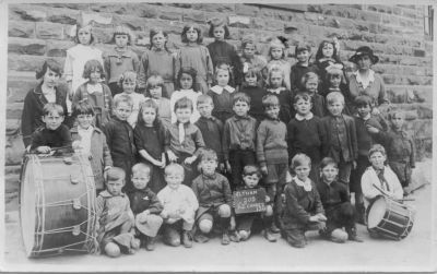 1921 - Betty Carrucan and Nellie Sweeney - Eltham Elementary School Grades 1 & 2
The Eltham Elementary School in Dalton Street (School Number 209) had been started in the 1850s and was just a stone's throw from the Carrucan farms and not too far from Culla Hill. All the Carrucan and Sweeney children attended and this photo of the 1921 Grade 1 and 2 class shows 39 children ranging in ages from about 6 to 10. Betty Carrucan is fourth from the left in the second row from the front. Her aunt Nellie Sweeney is the teacher on the right. 
