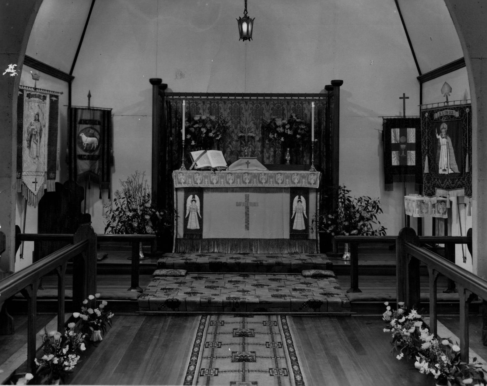 1950 St Linus Altar
This photo, produced for the St Linus 25 Year anniversary, showcases the alter which was richly decorated with tapestries and banners.
