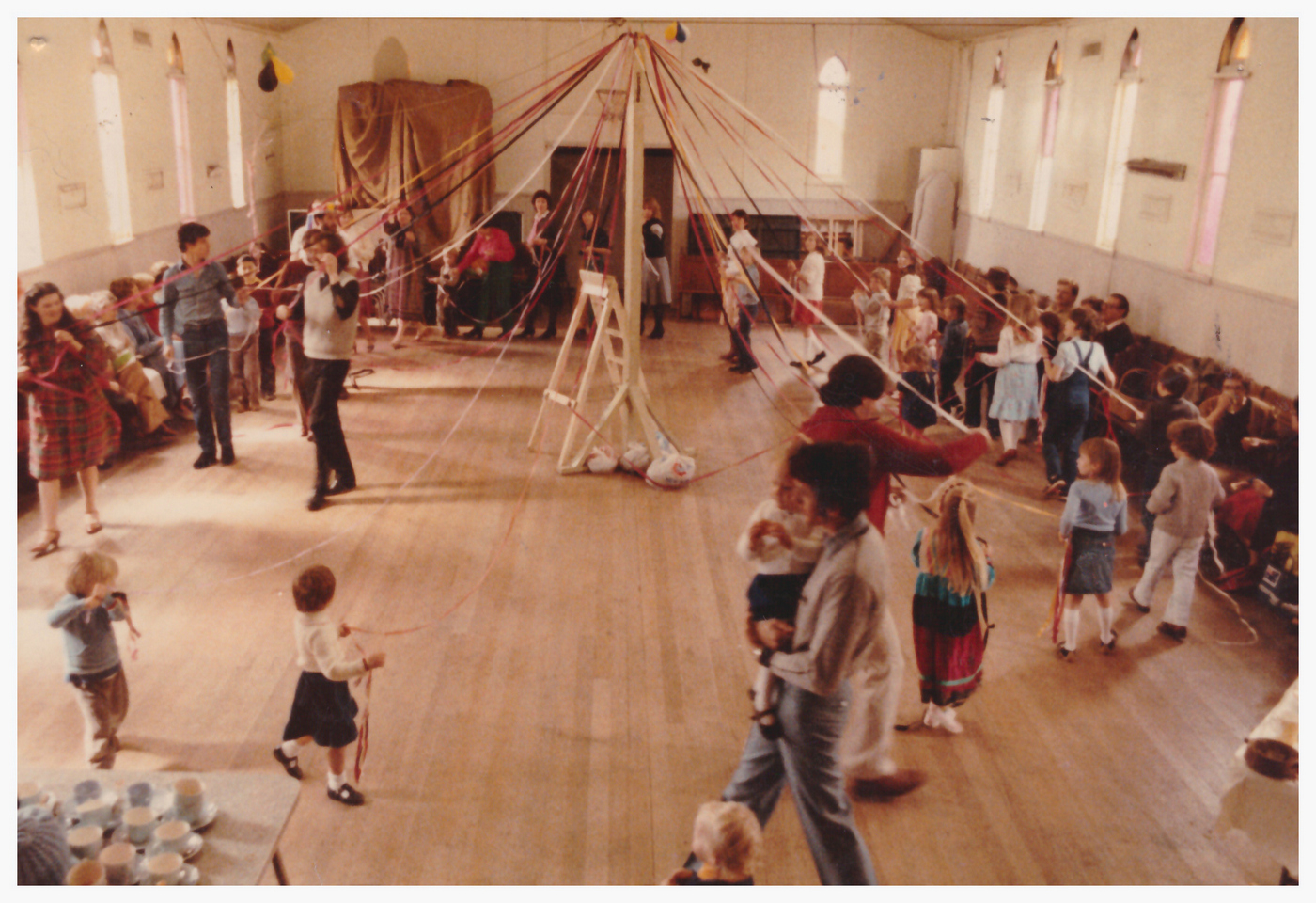 1980s mid - Spring Festival Colour
Rev Alan Cadwallader who had been at Holy Trinity Kensington, took over the Parish in late 1982.  Fr Alan was married and the parish, after some time, once again had a family at St Linus’ House.  Alan and Robin’s family of two children increased to four during their five years at St Linus’.  This was a time of much creativity and spiritual growth.  Outreach to the community increased as Alan’s spirit of inclusiveness found an expression in events such as the annual parish camp, attended by parishioners of all age groups and others, including the from kindergarten.  The annual Spring Festival, Easter and St Linus Day celebrations of Eucharist and feasting were very popular and the introduction of a Sunday night Taize service flowed from the raised interest in liturgical issues and attracted numbers of people from outside the parish. When Fr Alan left the parish in 1988, he left a legacy seen not only in the physical fabric of the church plant, but also in the deep spiritual growth of many parishioners.
