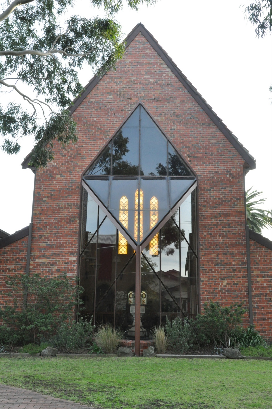 2016 Church Front View
This 2016 photo shows the front window, as viewed from Glyndon Avenue. This window was erected as part of the 1978 refurbishment and replaced what was a temporary wooden wall, erected in 1932 when the church building had to be stopped as available funds were exhausted. It was a temporary wall that lasted 46 years!
