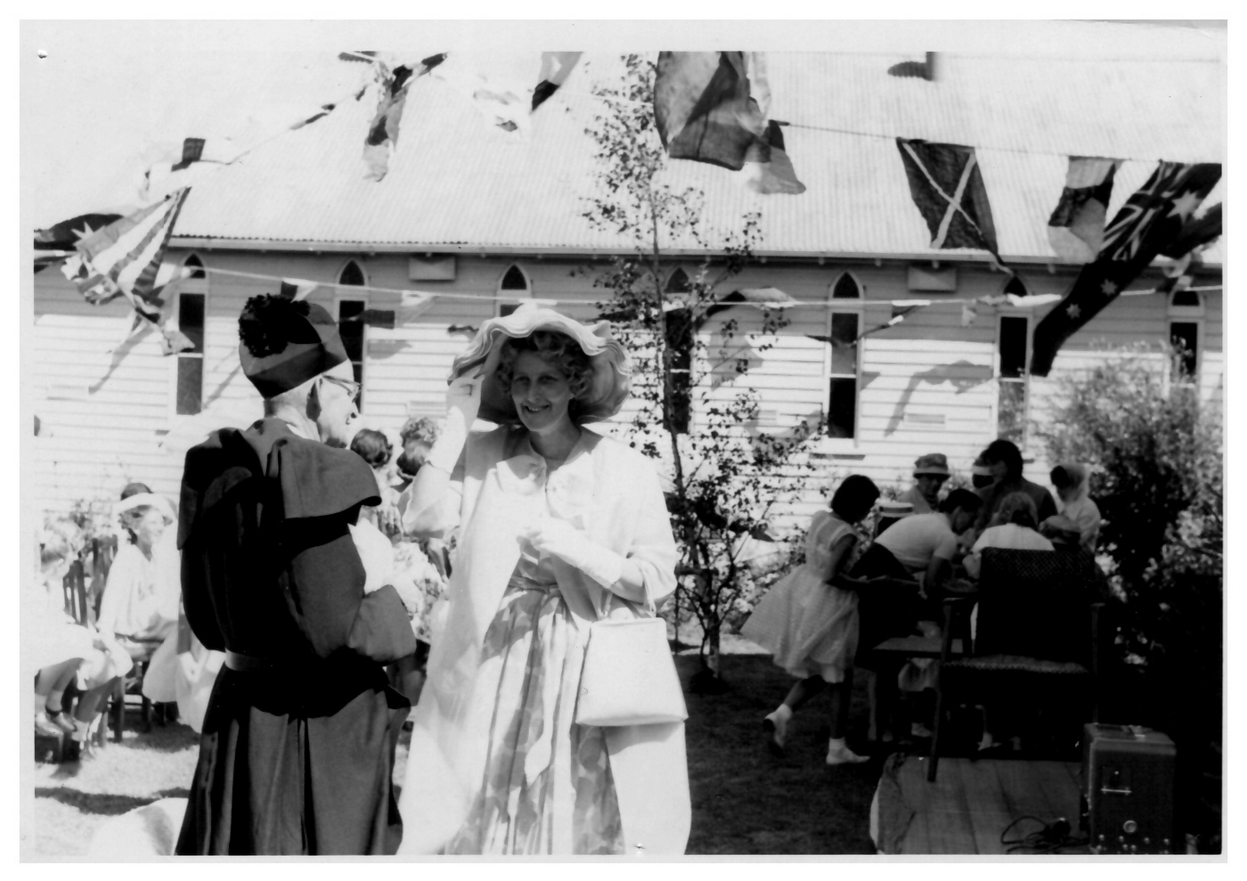 1960s St Linus Spring Festival - Rev. Oliver Hole
During the early years of St Linus, many church groups provided support for generations of parishioners - Sunday School, CEBS (Church of England Boys Society), GFS (Girls Friendly Society), Mothers’ Union and YAF (Young Anglican Fellowship) - as well as contributing vital funds to the ongoing support of the parish. Another important contributor to parish finances was the annual parish bazaar. This photo, taken in the 1960s, shows one such bazaar. Parish priest Rev. Oliver Hole is shown, dressed as usual with biretta and cassock.
"A lasting image is of Oliver Hole riding his bicycle around the streets of Merlynston in the 1950’s, biretta firmly placed on his head, full cassock tucked in around his waist."

