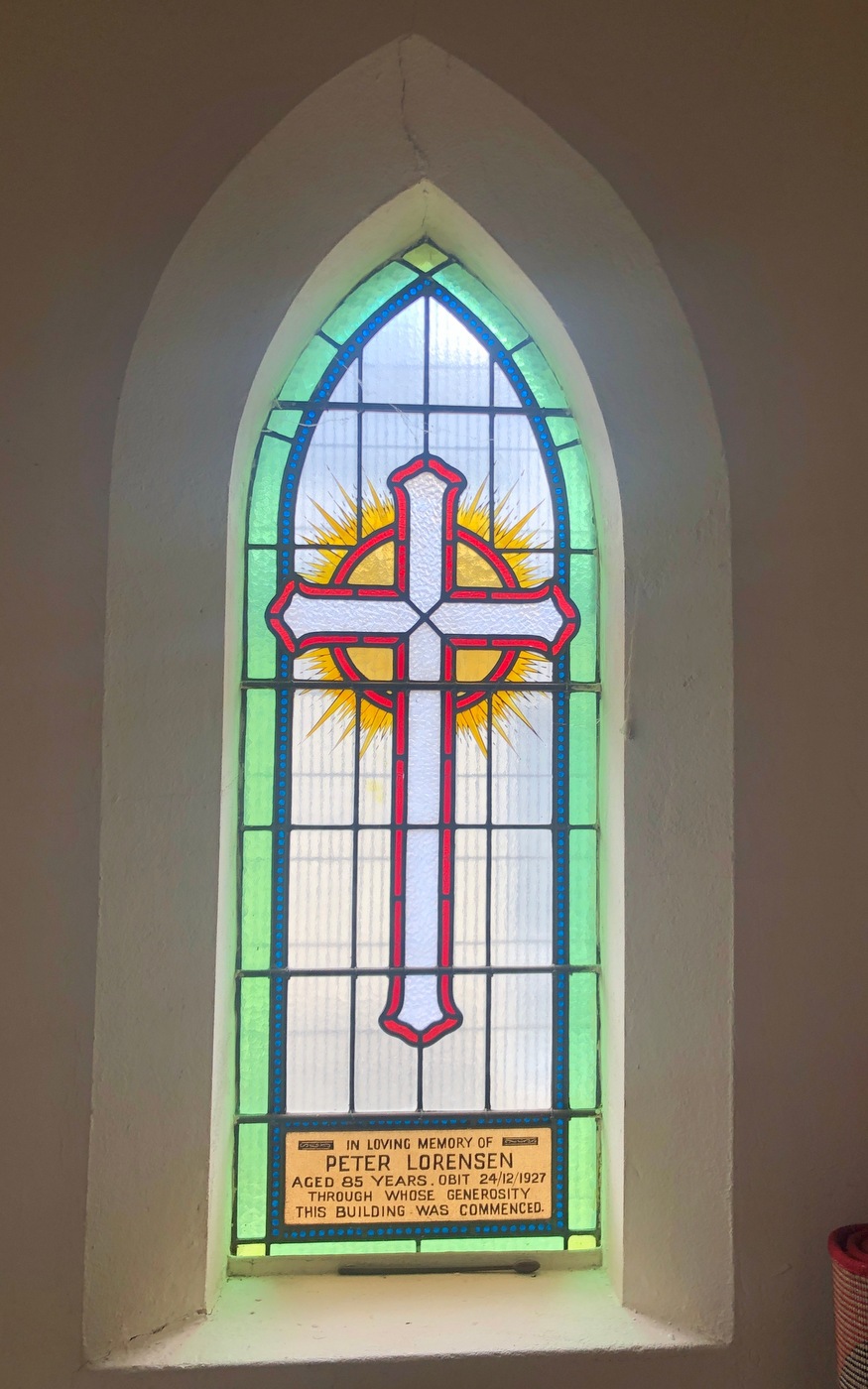 Window - 1927 Peter Lorensen
On Christmas Eve, 1927, Mr Peter Lorensen died.  A native of Denmark who resided in Australia for over 60 years, Peter attended St Paul’s Cathedral until services started in the St Linus hall.  He became a regular attendant and “the quiet influence of his genial Christian character won a wide circle of friends". Lorensen Avenue in Merlynston is named after him; however, he left a greater legacy – he left £1,000 for the building of a brick church, which made the consideration of that project possible.  The legacy was to be paid over 1932, provided that by that time sufficient funds has been raised to make up the amount needed to build a brick church.  




